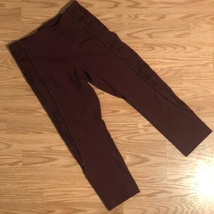 Maroon lululemon capri leggings with lace mesh sides and velvet ribbon detail